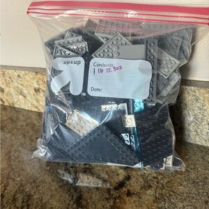 Bag of Lego flat assorted pieces that weighs 1lb 12 ounces